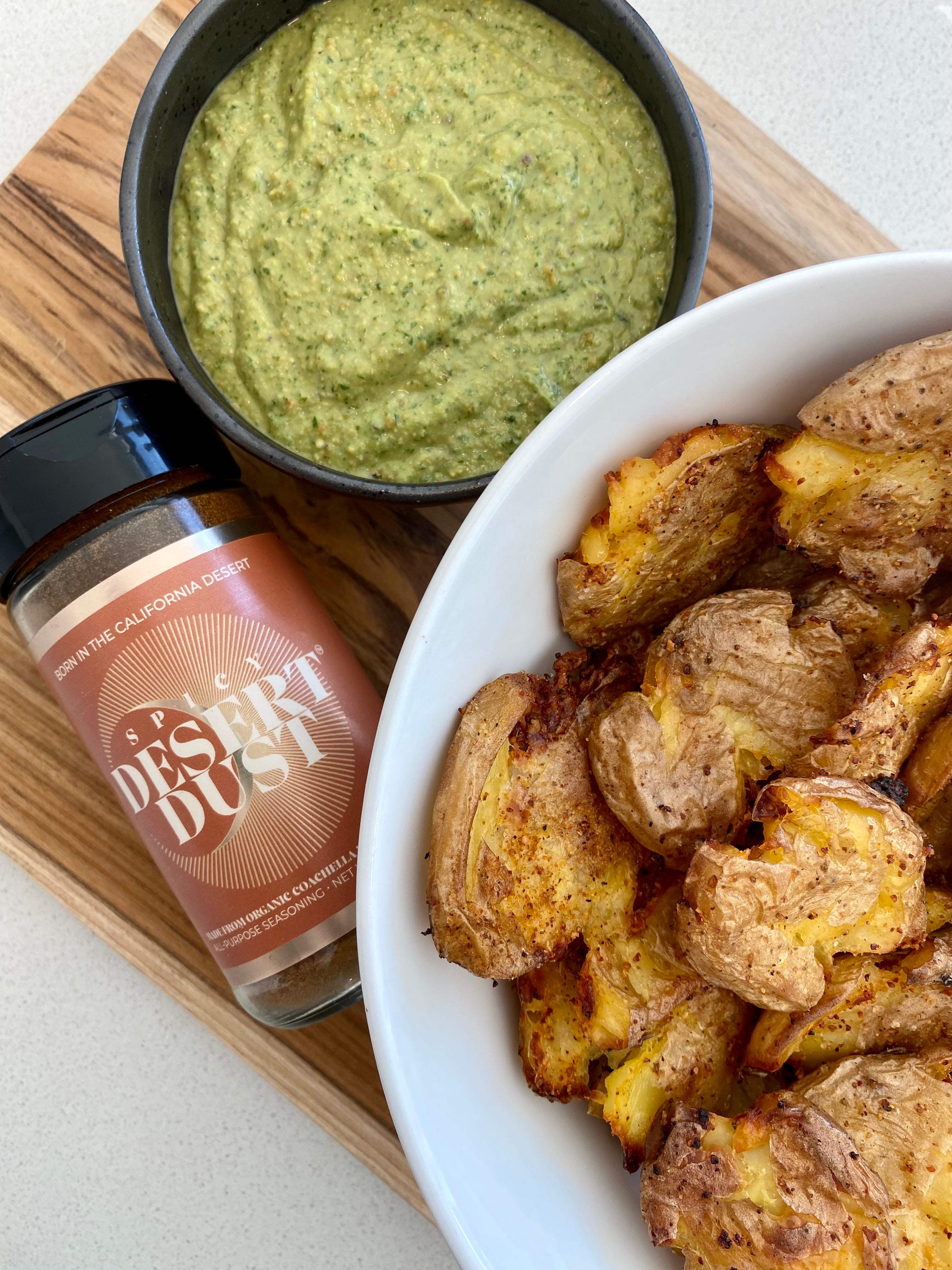 Smashed Potatoes with Spicy Desert Dust and Creamy Green Sauce