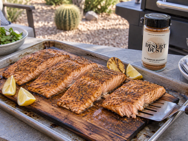 Cedar-plank salmon beside a desert patio grill with Original Desert Dust
