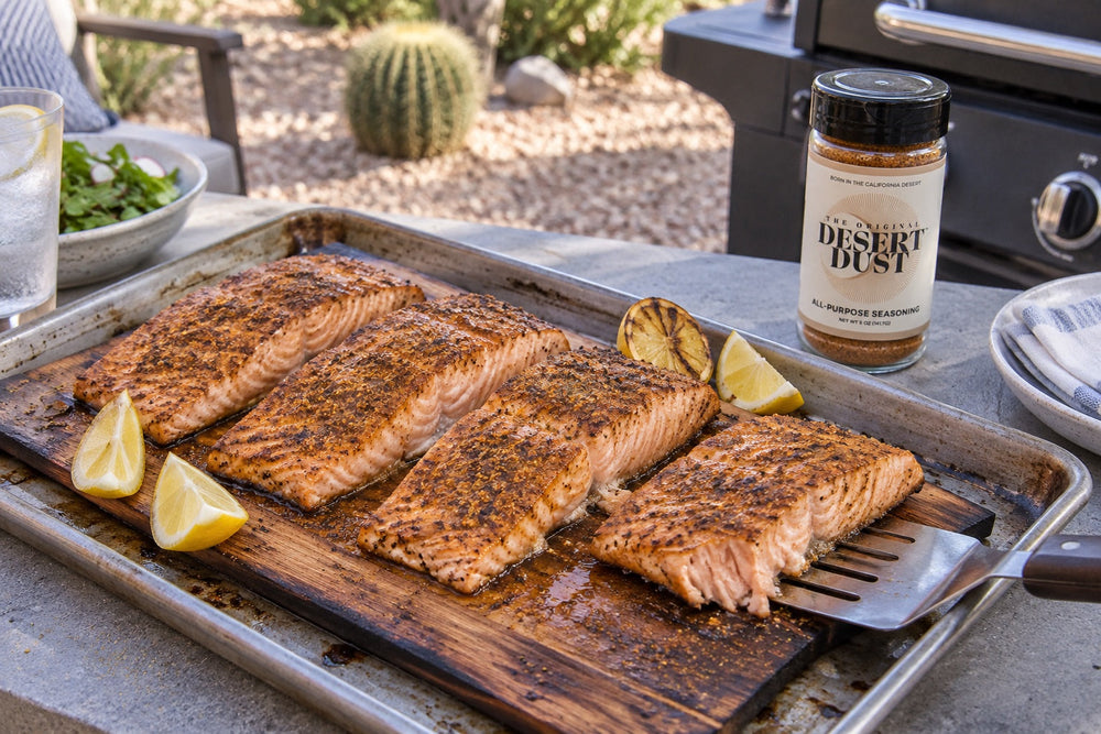 Cedar-plank salmon beside a desert patio grill with Original Desert Dust