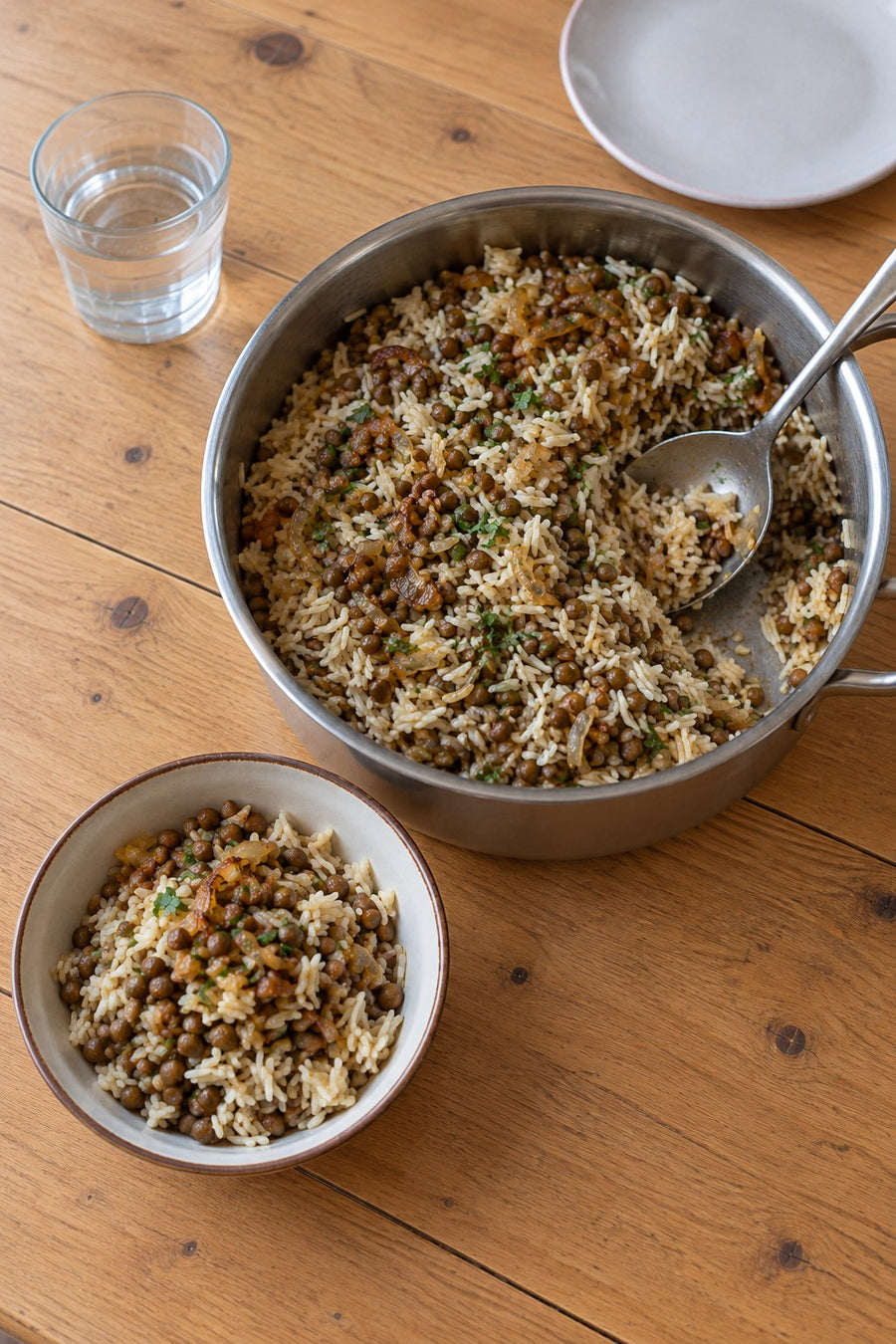 Lentils and rice with browned onions served from a saucepan