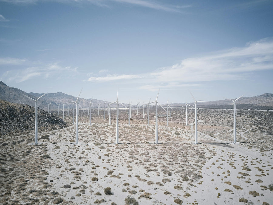 Wind turbines across an open desert valley