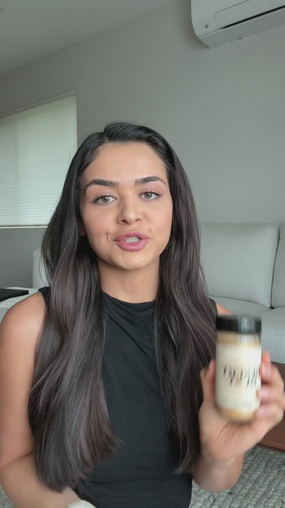 A person holding a Desert Dust seasoning bottle