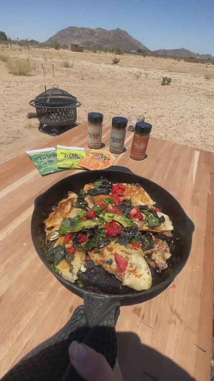 A skillet meal at a desert picnic table with Desert Dust seasonings