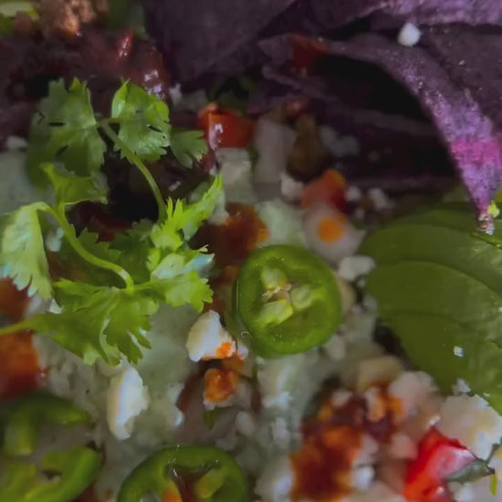 A meal topped with fresh herbs and Desert Dust seasoning