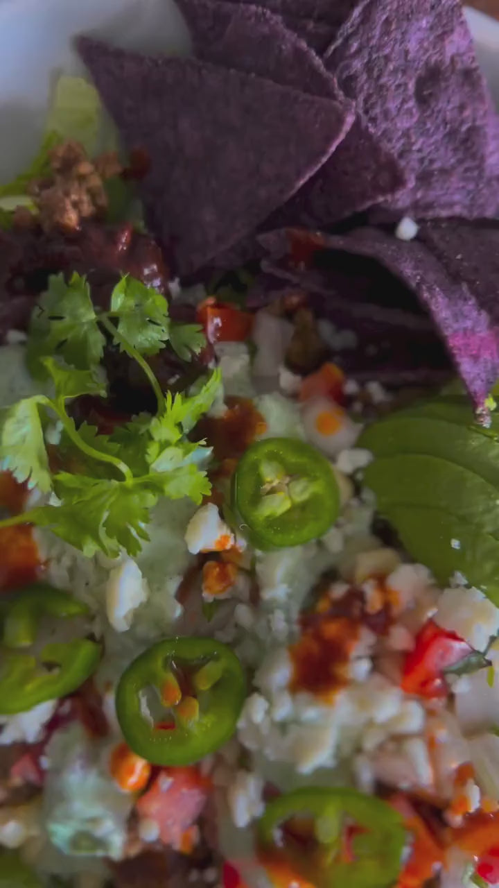 A meal topped with fresh herbs and Desert Dust seasoning