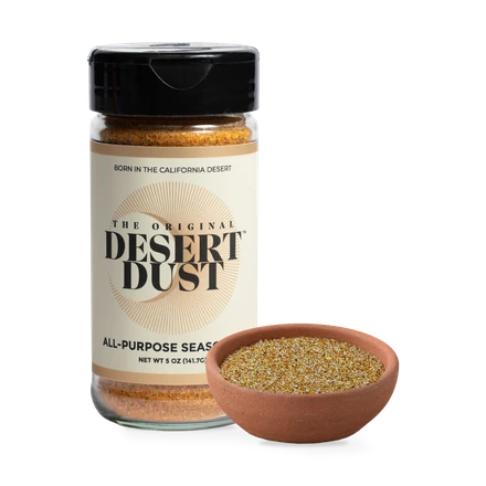 The Original Desert Dust beside a bowl of seasoning